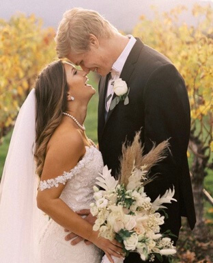 Austin Aaron with his wife Kristen McNamara on their wedding day